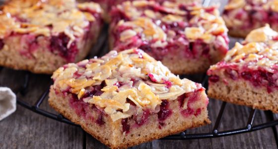 Berry,Cake,Bars,With,Caramel,Almond,Topping,On,A,Cooling